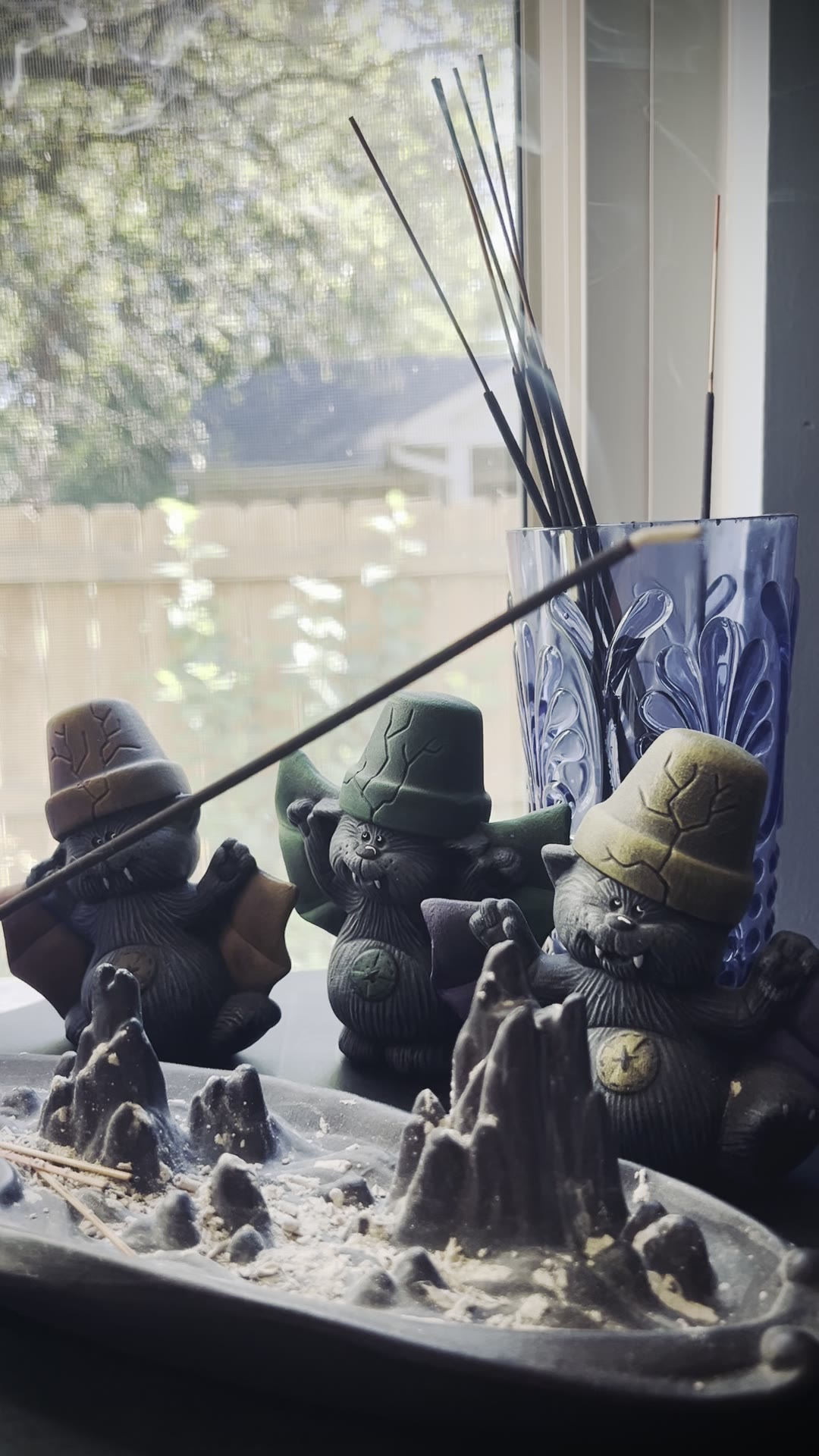 Purple Clover incense burning and releasing a thick column of white smoke